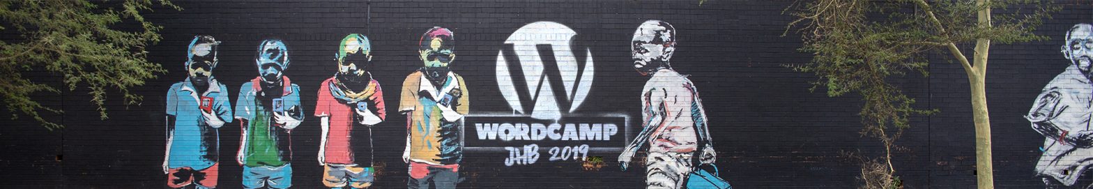 Wordcamp Johannesburg grafiti logo on a wall.